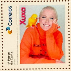 SI 126 Selo Institucional Xuxa Musica Papagaio Aves Mulher 2026